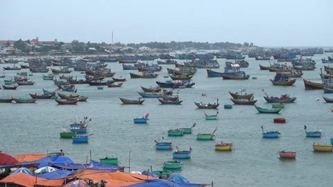 Blue Mui Ne beach full of fishery boats Stockbeeldmateriaal 90861288