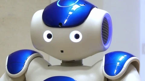 Blue nao robot humanoid blinking Stock Footage 70234096