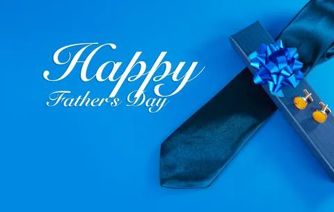 Blue necktie, cufflinks and gift box Stock Photos