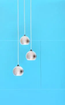 Blue negative collage of three ceiling lights, loft-style interi Stock-Fotos