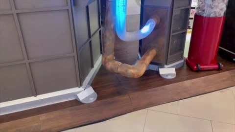 Blue neon light glowing inside a transparent pipe for creative interior. Видео 334324942