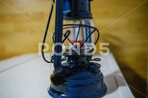 Blue new kerosene lamp in the room Stock Photos