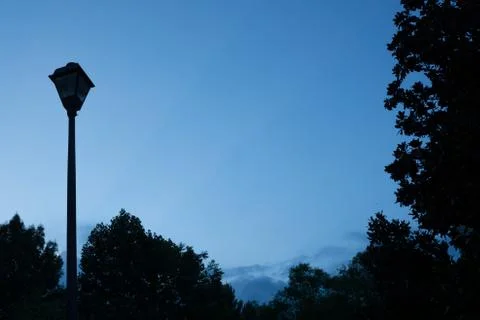 Blue night sky with lamp post and empty copy space for text Stock Photos