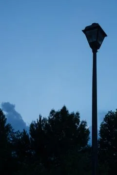 Blue night sky with lamp post and empty copy space for text Stock Photos