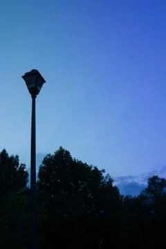 Blue night sky with lamp post and empty copy space for text Stock Photos