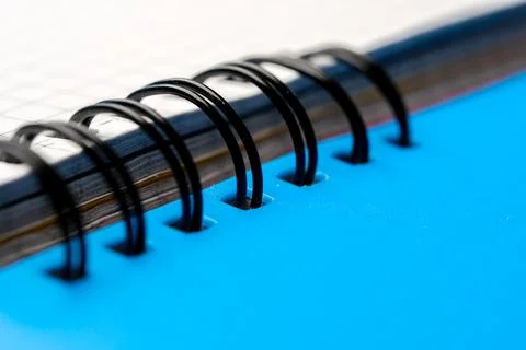 Blue notebook with spiral binding and organized pages Fotos de archivo