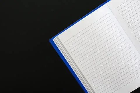 Blue notebook with text lines on white paper Stock Photos