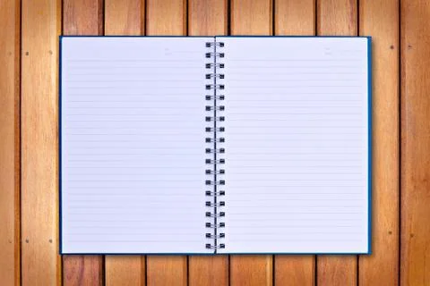 Blue notebook on wood background Stock Photos