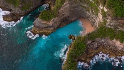 Blue ocean and cliffs covered with trees and grass. Bali shores from above. Aeri Stock Footage 109796928