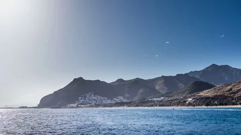 Blue ocean, beach, blue sky and traditional colorful houses on mountain Stock Footage 71779467