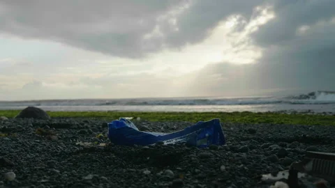 Blue Ocean Plastic on Stone Beach, Bali Stock Footage 147286772