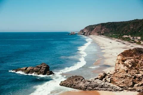 Blue   ocean   with   sandy   beach Stock Photos