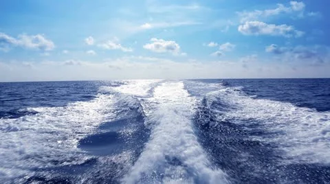 Blue ocean sea with fast yacht boat wake foam Stock Footage