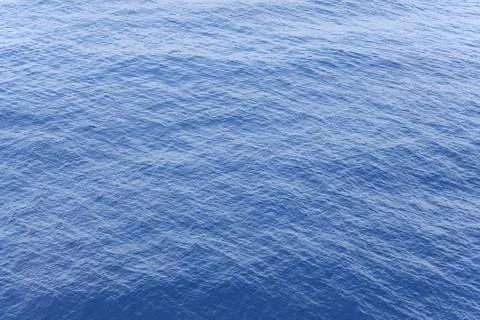 Blue Ocean Water Surface Texture with Natural Ripple Wave Pattern Aerial Vie Stock Photos