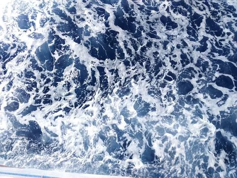 Blue Ocean Water Surface with White Sea Foam Stock Photos