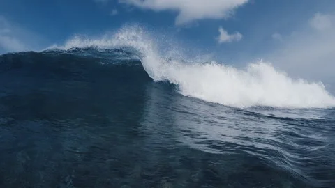 Blue ocean wave breaks on the camera with white foam. Underwater camera Stock Footage 346611258