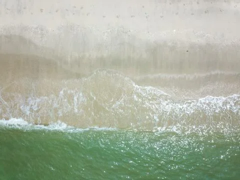 Blue ocean wave on clean sandy beach Photos