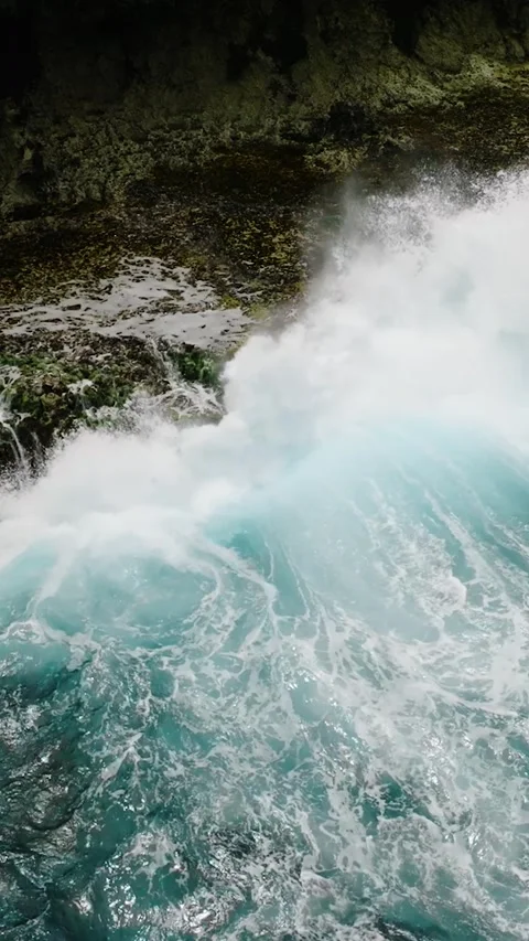 Blue ocean wave hitting sharp coastal rock formations. Siargao, Philippines. Stock Footage 321910116