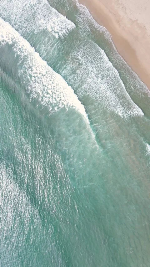 Blue ocean waves and beach aerial view, natural background. Video stock 317226734