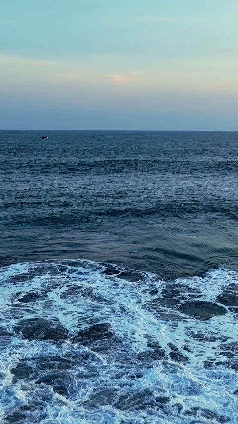 Blue ocean waves approaching dark sandy shore Stock-Footage 335432853