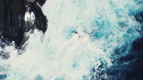 Blue ocean waves crashing onto the cliffs Video stock 237882622