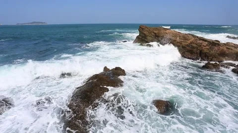 Blue Ocean waves crashing on the rocks Stock Footage 56432076