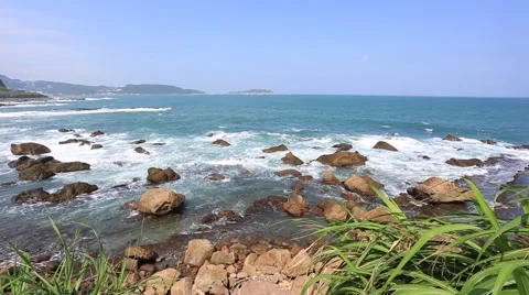 Blue Ocean waves crashing on the rocks Stock Footage 58633335