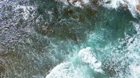 Blue Ocean Waves Crashing onto Rocks Video stock 297119052