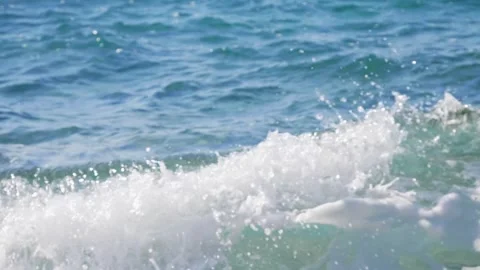 Blue ocean waves crashing with white foam on the shoreline. Stock Footage 337406139