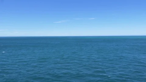 Blue ocean waves as seen from ferry at sea, water slowly passing by Stock Footage 83829070