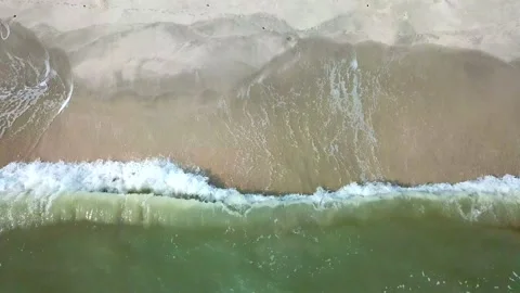 Blue ocean waves Sunlight Reflection and Sand Beach background. 4K Clips Stock Footage 132584656