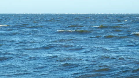 Blue Ocean Waves With a View of Distant Fire Island 4K Stock Footage 156576489