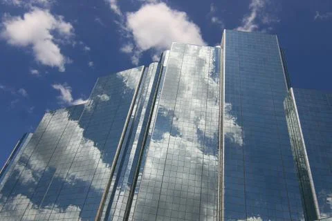 Blue Office building with clouds Stock Photos