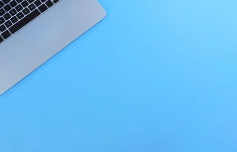 Blue office desk table with computer. Top view with copy space in flay layout Stock Photos