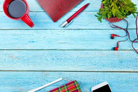 Blue office desk table with computer, pen and a cup of coffee, lot of thing.. Stock Photos