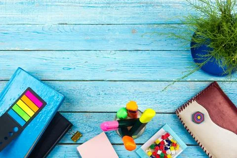 Blue office desk table with computer, pen and a cup of coffee, lot of thing.. Stock Photos
