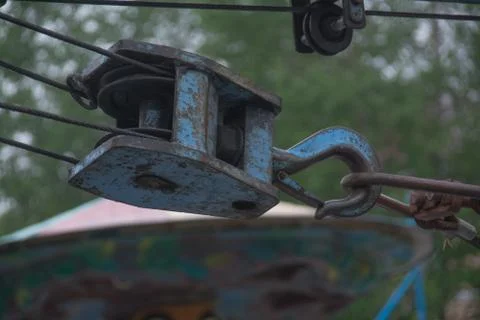 Blue old rusted winch in use outside Stock Photos