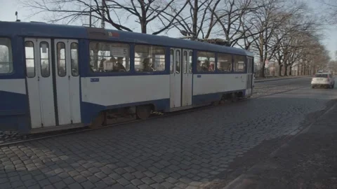 Blue Old Tram Drives Through a Street in Riga Stockbeeldmateriaal 221854108