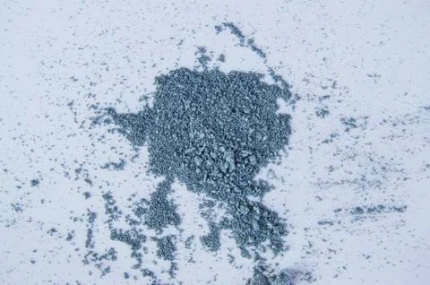 Blue or gray eye shadows, scattered crumbs on white background Foto stock