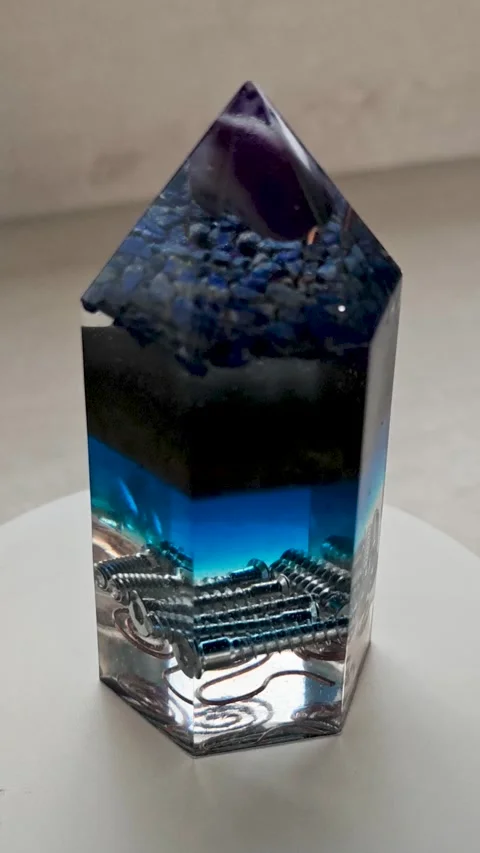 Blue Orgonite Pyramid with Eight Facets Rotating 360 Degrees on Turntable Over Stock Footage 336801743