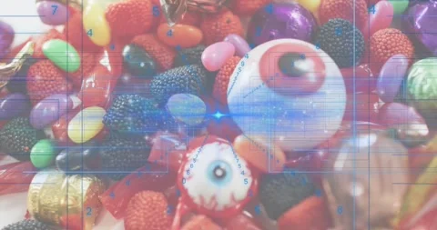 Blue overlay starting scanning across candies highlighting wrappers then Stock Footage 317835387
