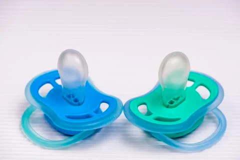 Blue pacifier on white background. pacifiers colored pacifiers Stock Photos