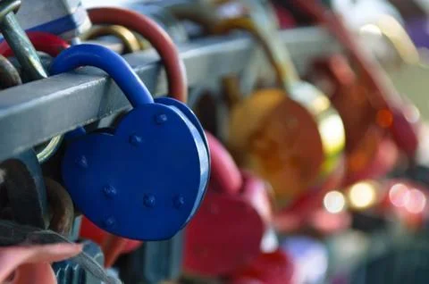 Blue padlock. Close-up. Blurred background. Stock Photos