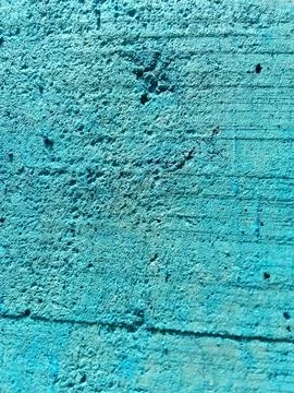 Blue paint background, rough texture of concrete wall. Фото