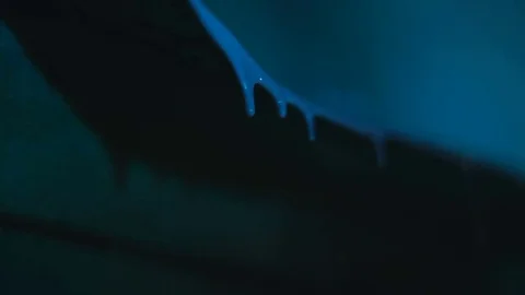 Blue paint drips down Stock Footage 81699381