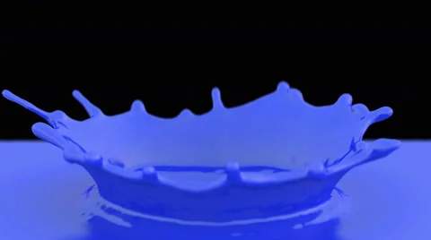 Blue paint drop falling in slow motion in paint making beautiful crown splash Stock Footage 59460882