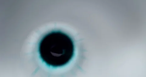 Blue paint droplets diluting clear liquid Stock Footage 114086063