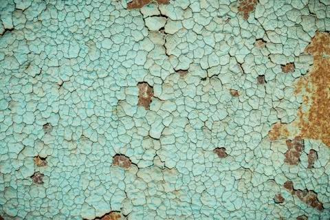 Blue paint flaking and cracking texture on rusty metal. Stock-Fotos
