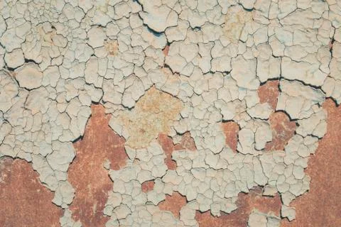 Blue paint flaking and cracking texture on rusty metal. Stock Photos