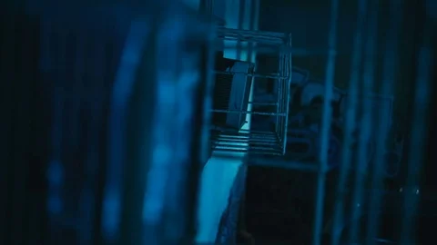 Blue paint flows slowly down the grate Stock Footage 81699517